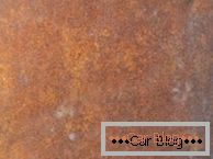 Zdjęcie powierzchniowych przejawów rdzy na karoserii